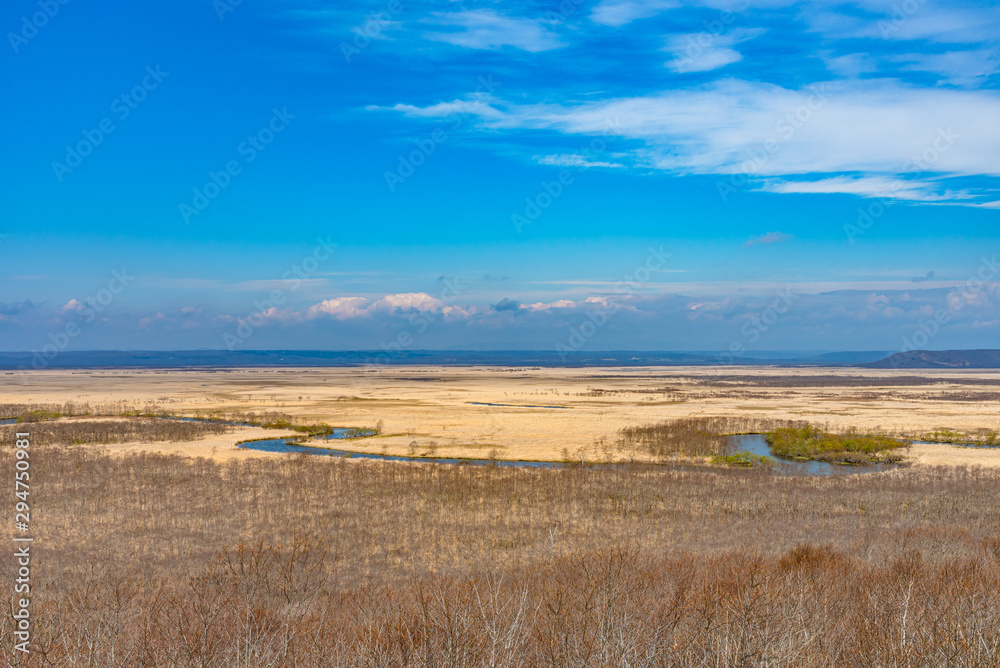 Fototapeta premium Kushiro Shitsugen national park in Hokkaido in spring day, view from Hosooka observation deck, the largest wetland in Japan. The park is known for its wetlands ecosystems