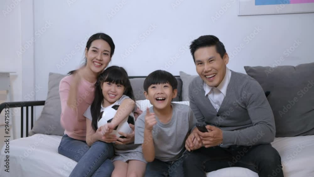 Family concept. Parents and children cheering football together in the house. 4k Resolution. Family concept. Parents and children cheering football together in the house. 4k Resolution.
