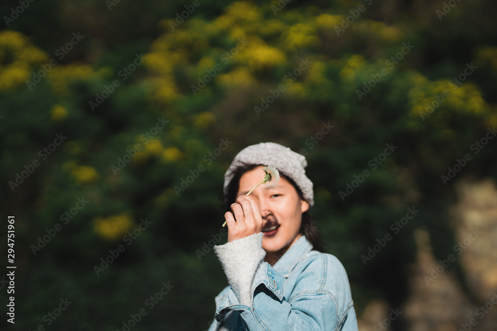 Happy girl playing with Dandelion flower Happy girl playing with Dandelion flower