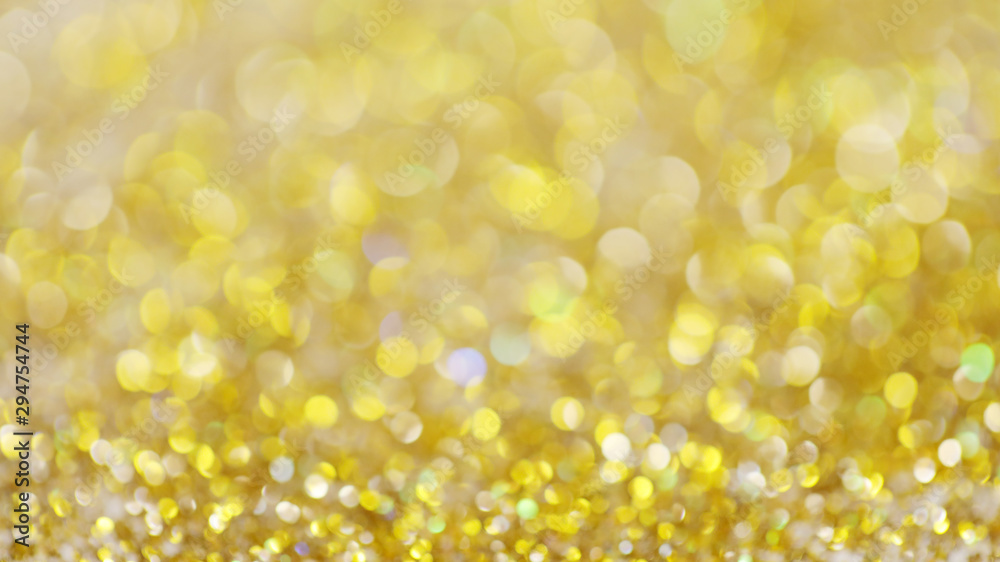 Lights on gold with star bokeh background.Gold celebration background for anniversary, New Year Eve, Christmas, falling coins, wedding or birthday Lights on gold with star bokeh background.Gold celebration background for anniversary, New Year Eve, Christmas, falling coins, wedding or birthday