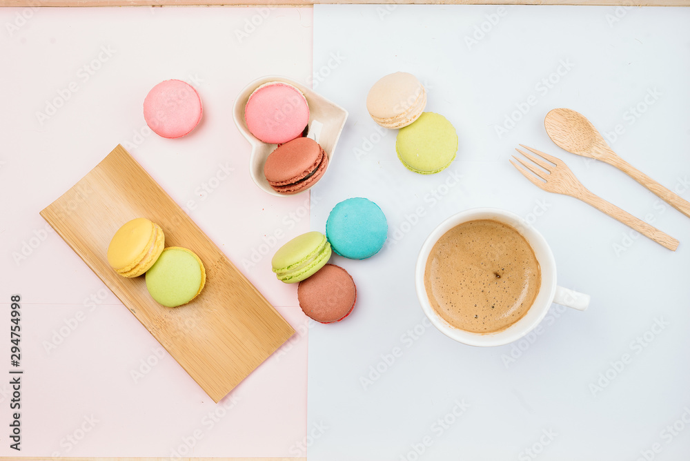 Delicious and colorful macarons placed on a wooden tree decorated with sweet coffee. Delicious and colorful macarons placed on a wooden tree decorated with sweet coffee.
