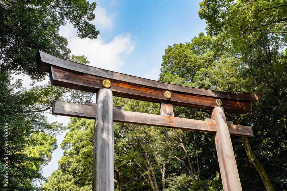 Wooden Torii gateway, the traditional Japanese gate at Shinto Shrine, Meiji-jingu in Tokyo, Japan. Wooden Torii gateway, the traditional Japanese gate at Shinto Shrine, Meiji-jingu in Tokyo, Japan.