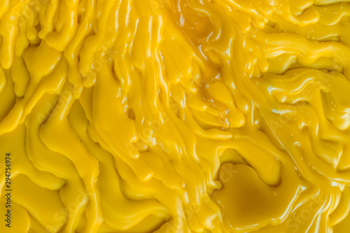 Φωτογραφία Top view of the candle melts droplets dissolve in yellow from lighted candlestic