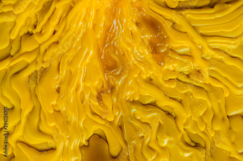 Εκτύπωση καμβά Top view of the candle melts droplets dissolve in yellow from lighted candlestic
