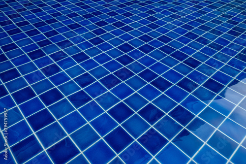 Dark blue floor table in the pool
