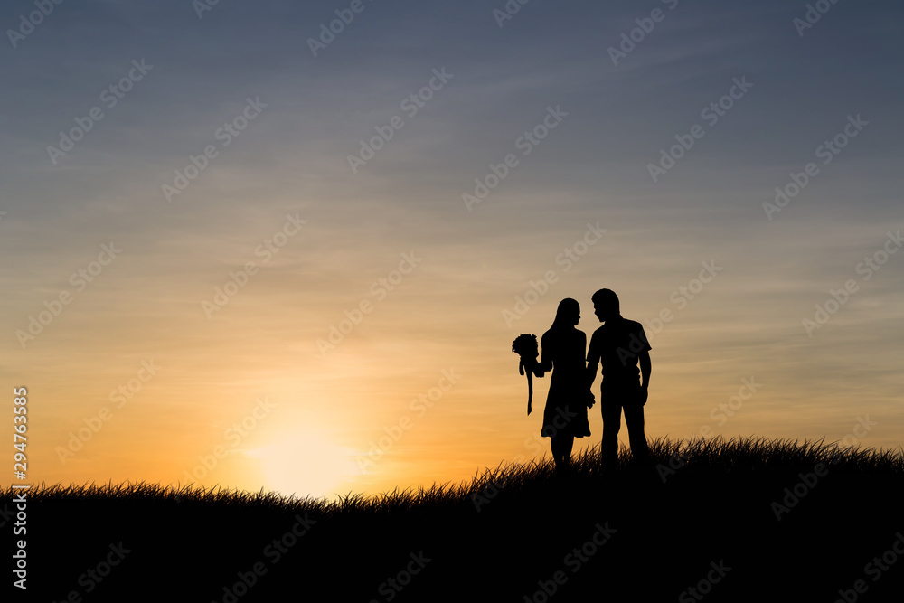 Silhouettes of couple man and woman in nature sunset background. Love concept. Silhouettes of couple man and woman in nature sunset background. Love concept.