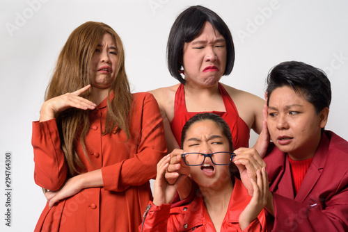 Group of diverse Asian friends in funny struggling situation together