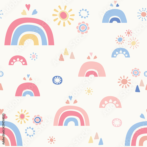 Vector seamless repeat of stylized blue and pink rainbows, hearts and flowers. Sweet hand drawn design background ideal for children.