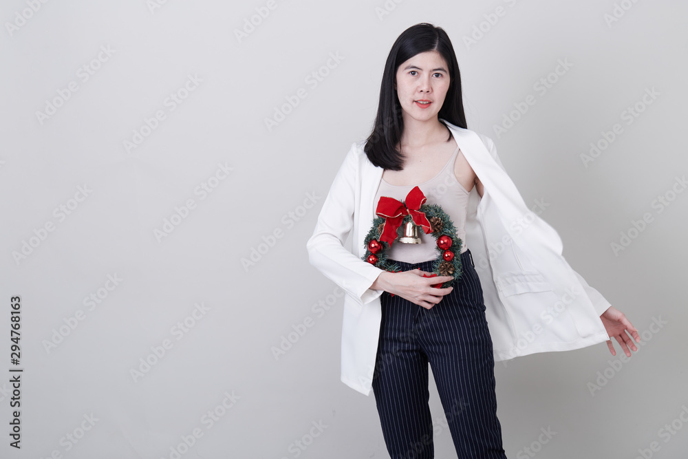 Cheerful christmas young asian woman gesturing Cheerful christmas young asian woman gesturing