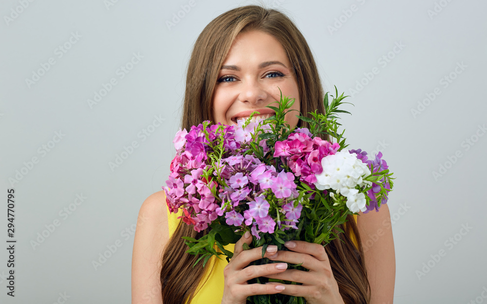 Happy woman holding flowers bouquet.