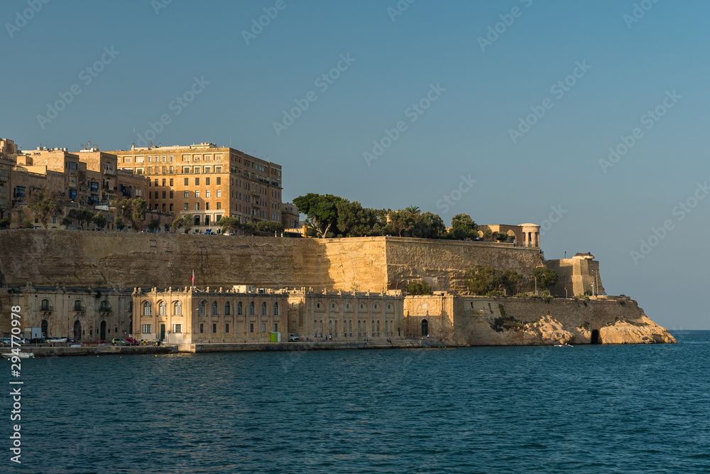 The Beautiful Valetta Fortifications in a Game of Light and Shadow at Sunset The Beautiful Valetta Fortifications in a Game of Light and Shadow at Sunset