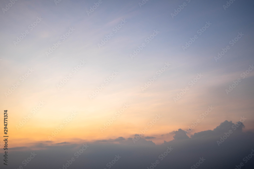 Sunset sky with orange clouds. The sky and sun at sunrise nature background.
