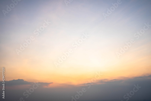 Sunset sky with orange clouds. The sky and sun at sunrise nature background.
