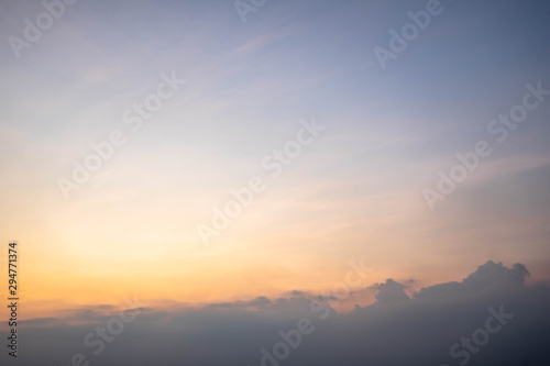 Sunset sky with orange clouds. The sky and sun at sunrise nature background.