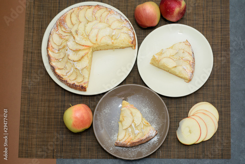 fresh apple pie cut into triangular pieces. View from above