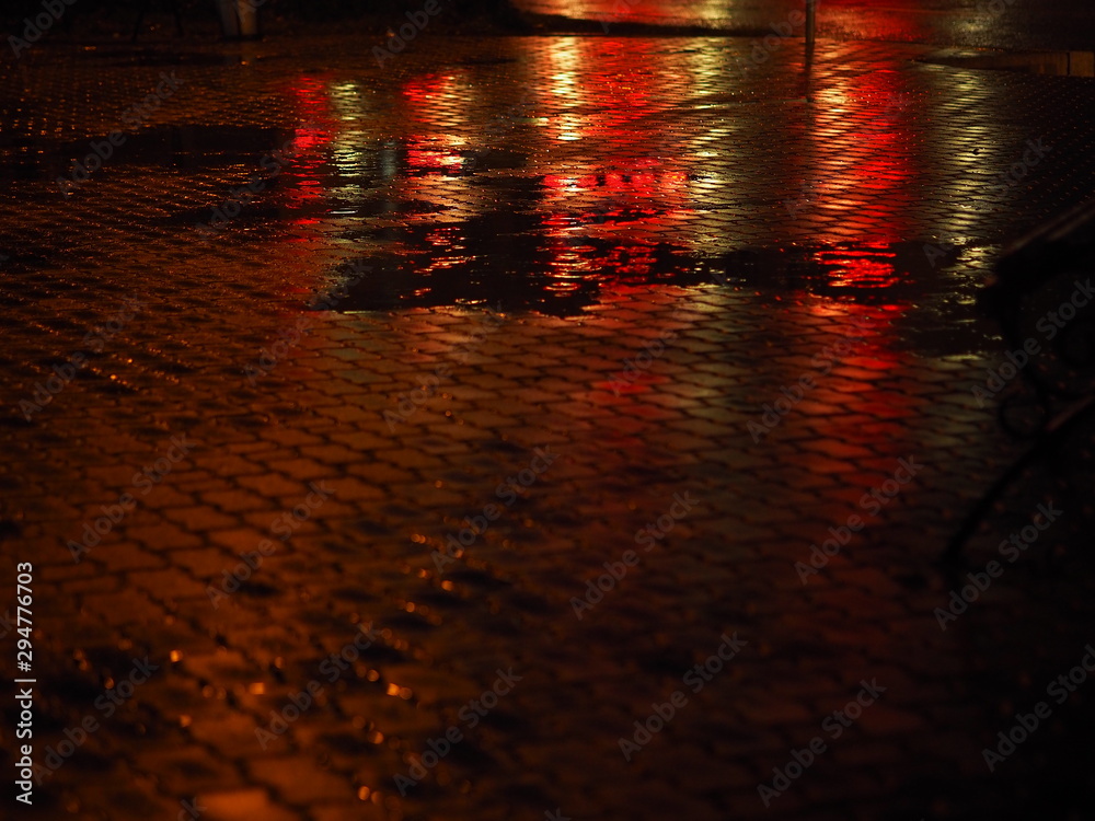 Blurred background of the night rainy city. Neon light