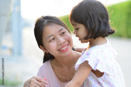 Little Child Girl and Mother Close Up Portrait Focus