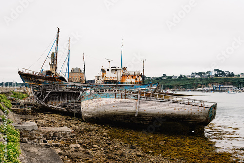 Old abandoned shipwrecks in the old boat cemetery  Cimetiere de bateaux. at Le Sillon a cloudy day of summer