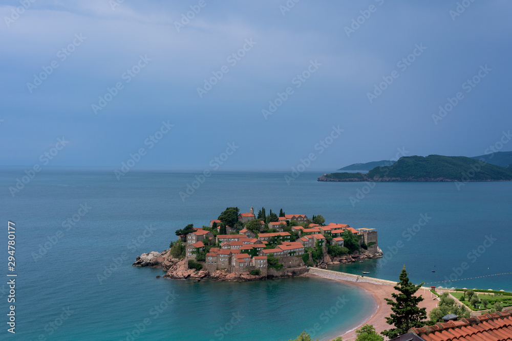 Montenegro, an island with houses in the sea. Adriatic Sea. Summer holiday at sea