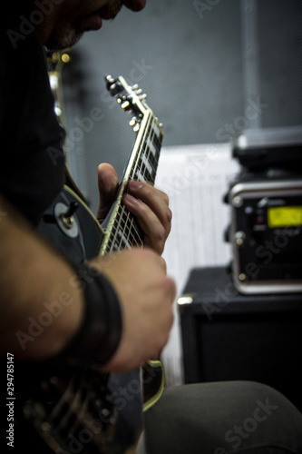 Playing guitar close up photo