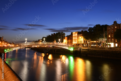 Dublin  Ireland. Night view of famous illuminated Ha Penny Bridge in Dublin  Ireland  at sunset