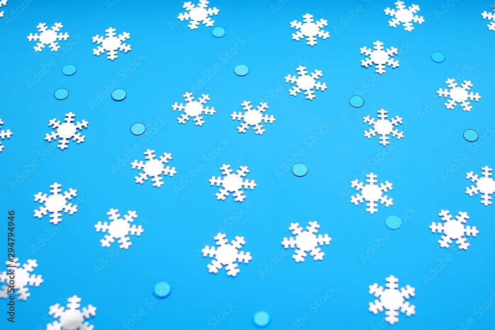 Snowflakes on a blue background. Happy New Year and Christmas background. Snowflakes on a blue background. Happy New Year and Christmas background.