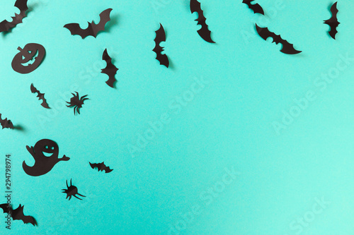 Halloween paper decorations on pastel blue background. Halloween concept. Flat lay, top view, copy space - Image © Fototocam