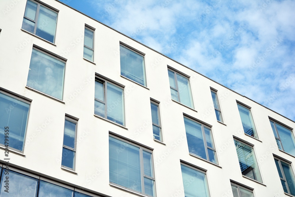 The windows of a modern building for offices. Business buildings architecture. The windows of a modern building for offices. Business buildings architecture.