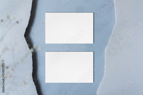 Business card mockup with torn paper