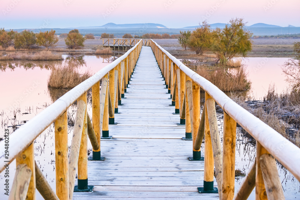 Wooden walkway in the lagoon of Fuente de Piedra, Malaga. Spain Wooden walkway in the lagoon of Fuente de Piedra, Malaga. Spain