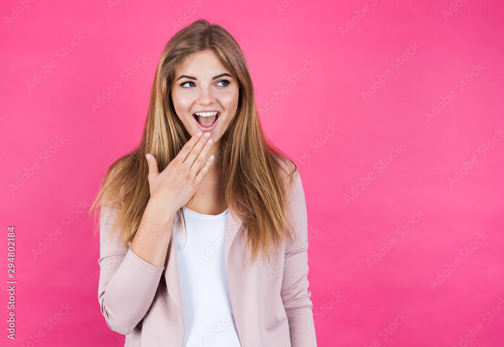 Young blonde girl astonished, isolated on pink background Young blonde girl astonished, isolated on pink background
