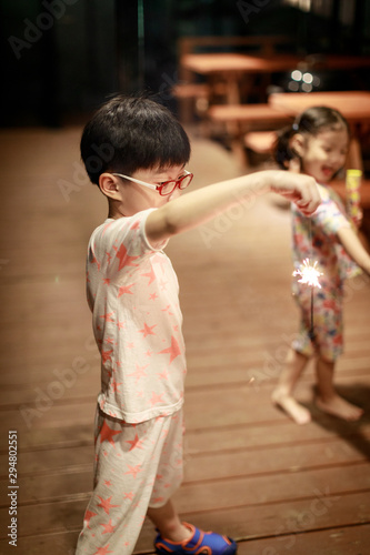 Child holds in his hands a Sparkler