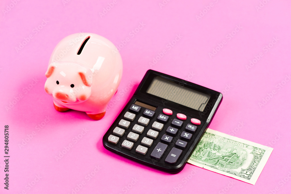 Credit debt concept. Economics and profit management. Economics and finance. Exchange rates. Economics and business administration. Piggy bank money savings. Piggy bank pink pig and calculator Credit debt concept. Economics and profit management. Economics and finance. Exchange rates. Economics and business administration. Piggy bank money savings. Piggy bank pink pig and calculator