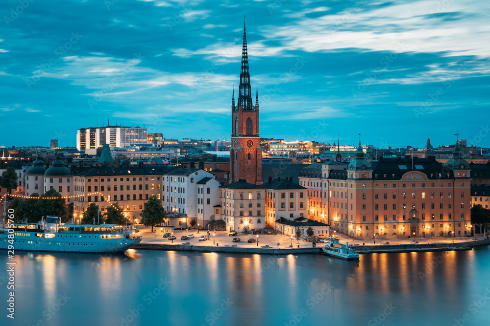 Stockholm, Sweden. Scenic View Of Stockholm Skyline At Summer Evening. Famous Popular Destination Scenic Place In Dusk Lights. Riddarholm Church In Night Lighting
