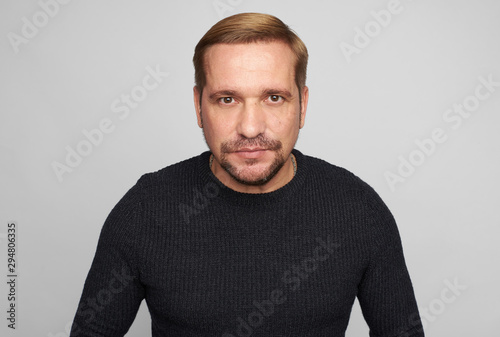 Bearded man studio portrait. Isolated on grey studio background