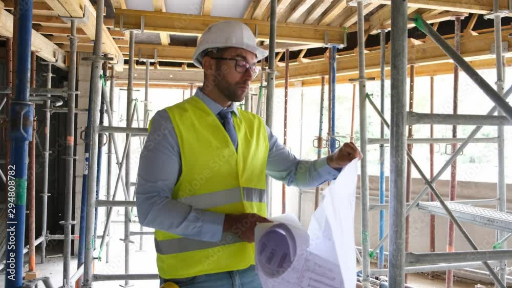 portrait of handsome foreman construction worker on a industrial building industry construction site 4 K 50 fps footage portrait of handsome foreman construction worker on a industrial building industry construction site 4 K 50 fps footage