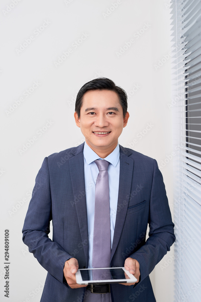 Product presentation. Promotion. Business man holding in hands tablet computer with blank screen, close up.