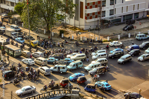 Jakarta, Indonesia - September 13, 2009: aerial view at a crossroad with many cars and motorbikes in a traffic jam
