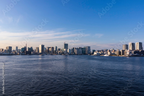 View of the Tokyo Bay during the day from the Rainbow Bridge in Odaiba. Busy waterway with ships. Landscape Orientation.