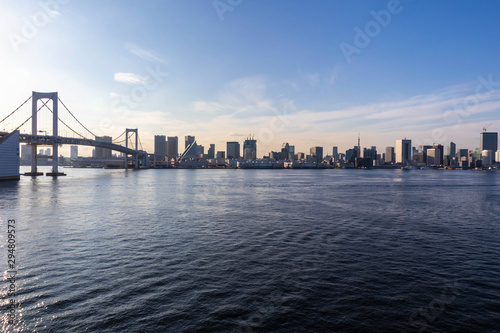 View of the Tokyo Bay during the day from the Rainbow Bridge in Odaiba. Busy waterway with ships. Landscape Orientation. © HafizMustapha