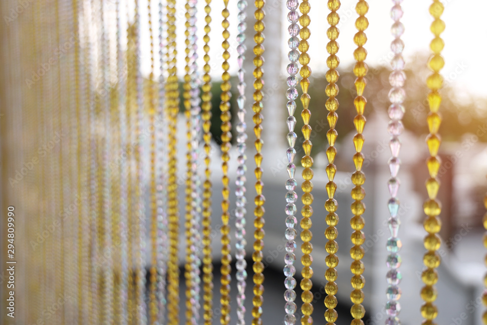 Close up Bead curtains close in and out of the church Of a temple - obrazy, fototapety, plakaty 