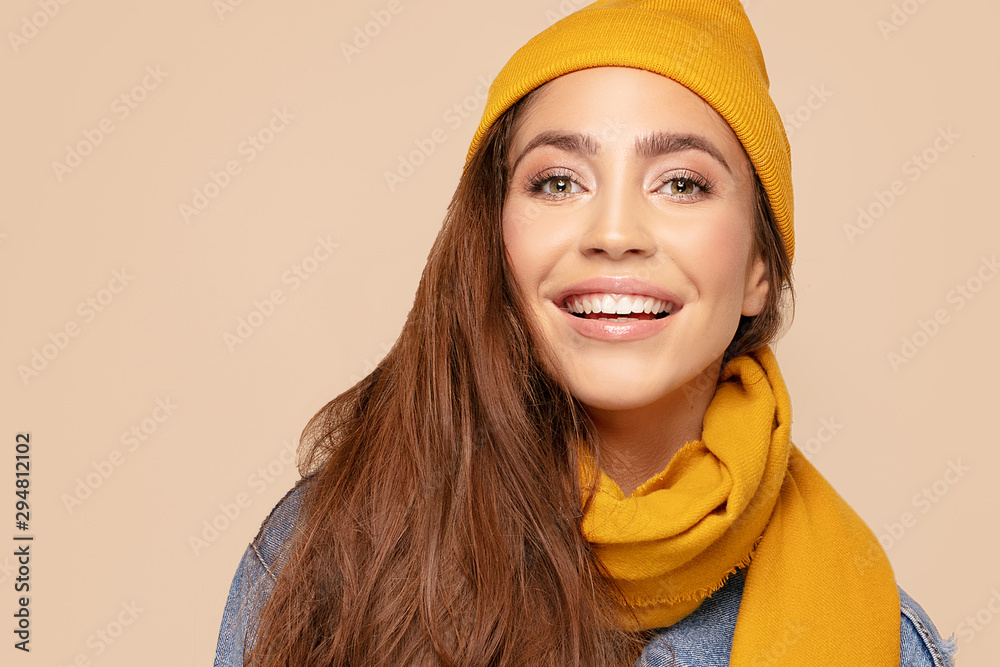 Happy girl in autumn cap and scarf. Happy girl in autumn cap and scarf.