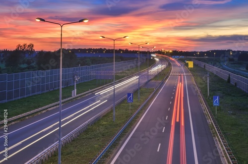 Highway at night. Beautiful colorful sky with the setting light over the A1 highway in Poland.