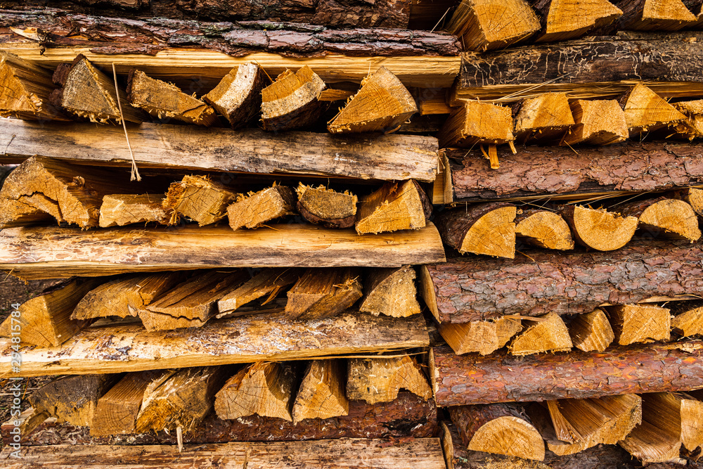 wooden piles as a background from freshly cut trees, wood for fireplace 
