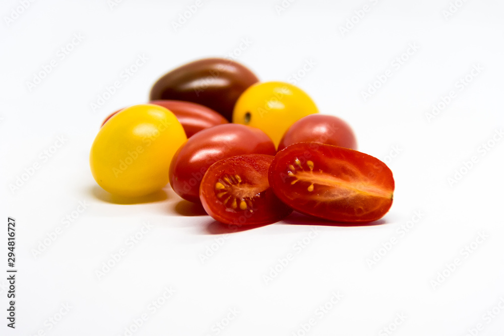 Fresh and colorful cherry tomatoes on white background Fresh and colorful cherry tomatoes on white background