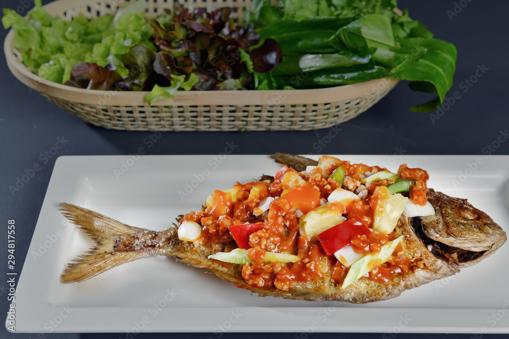 food background of Thai style sweet and sour deep fried butterfish with