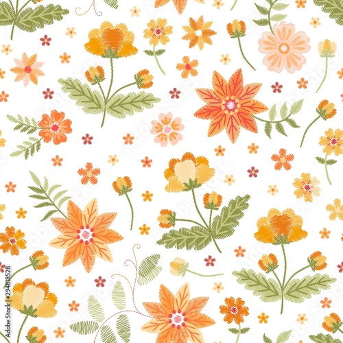 Embroidery seamless pattern with beautiful yellow and orange flowers on white background. Fashion design.