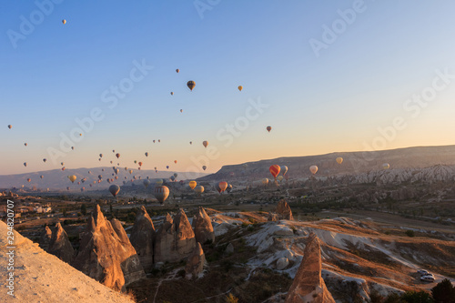 Sunrise in Cappadocia. Hot air baloons flying over the valley