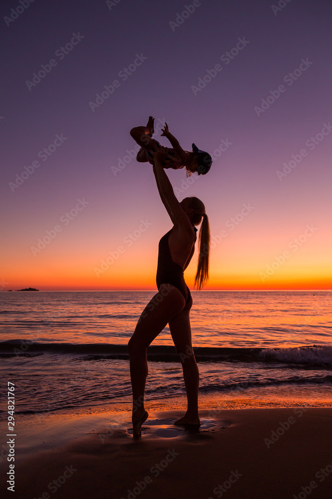 Mother and daughter at the sea