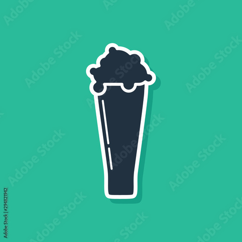 Blue Glass of beer icon isolated on green background. Vector Illustration